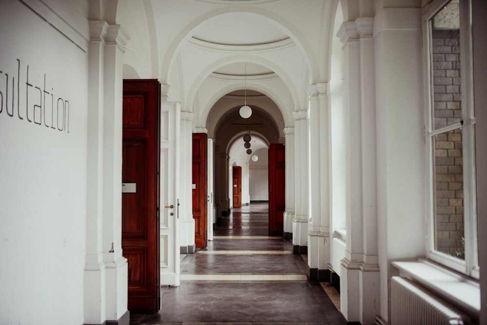 white and brown hallway with no people