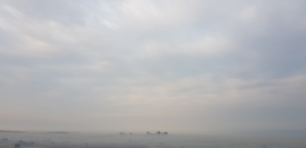 white clouds over city skyline during daytime