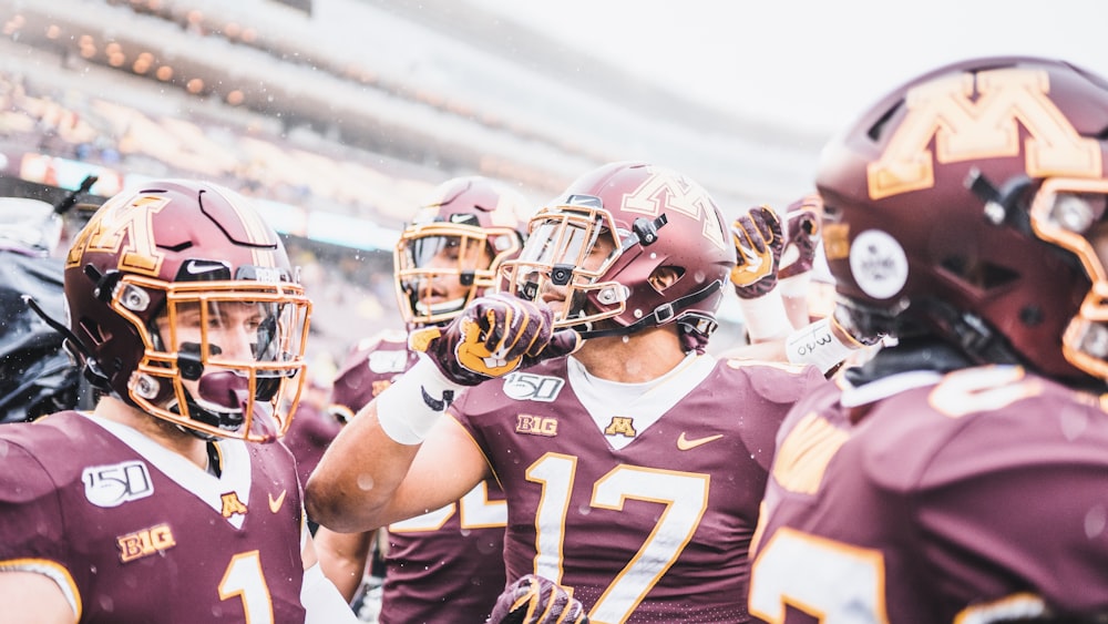 a group of football players standing next to each other