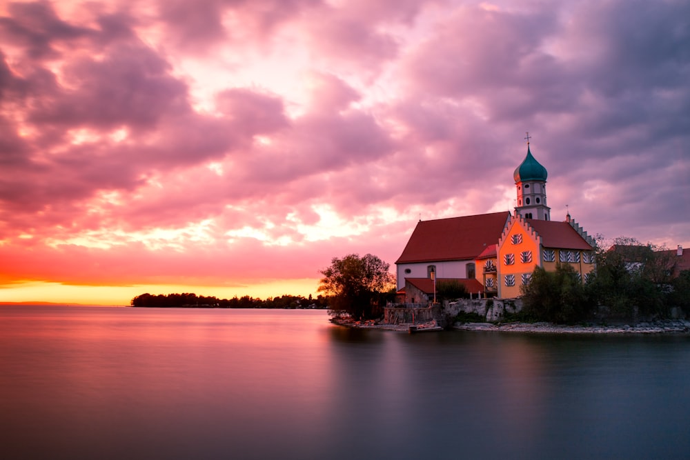 a church on a small island in the middle of a lake