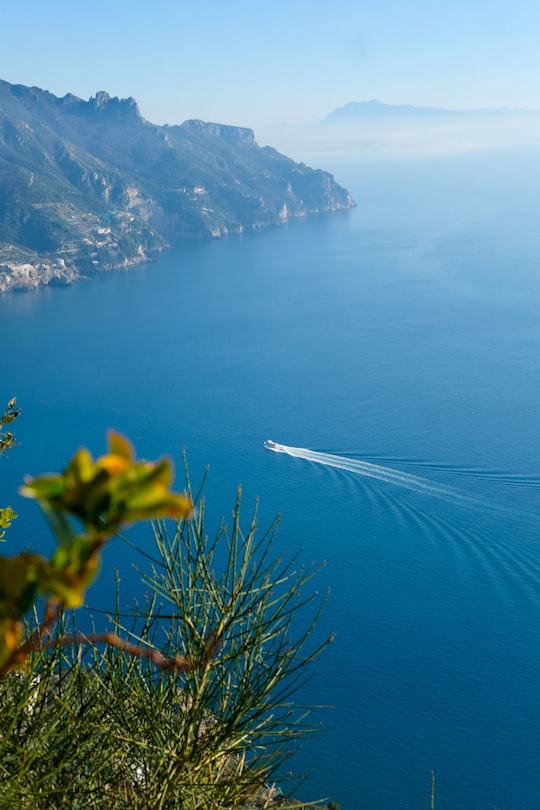 white and black boat on sea near mountain during daytime in Ravello Italy