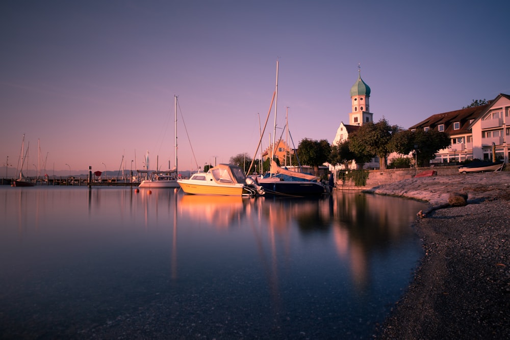 a group of boats that are sitting in the water