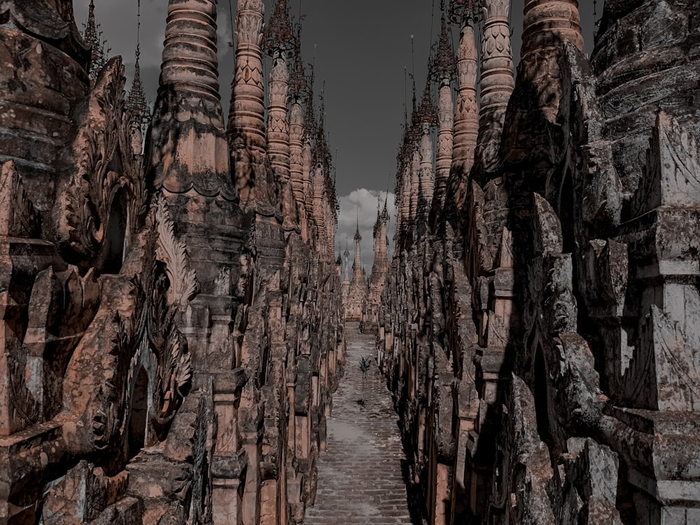 brown rock formation on body of water during daytime