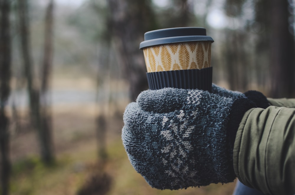 person in gray knit sweater and gray knit cap