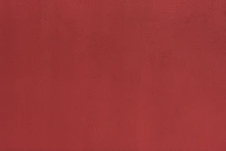 a close up of a red wall with a white background