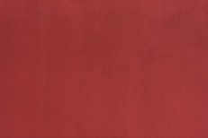 a close up of a red wall with a white background