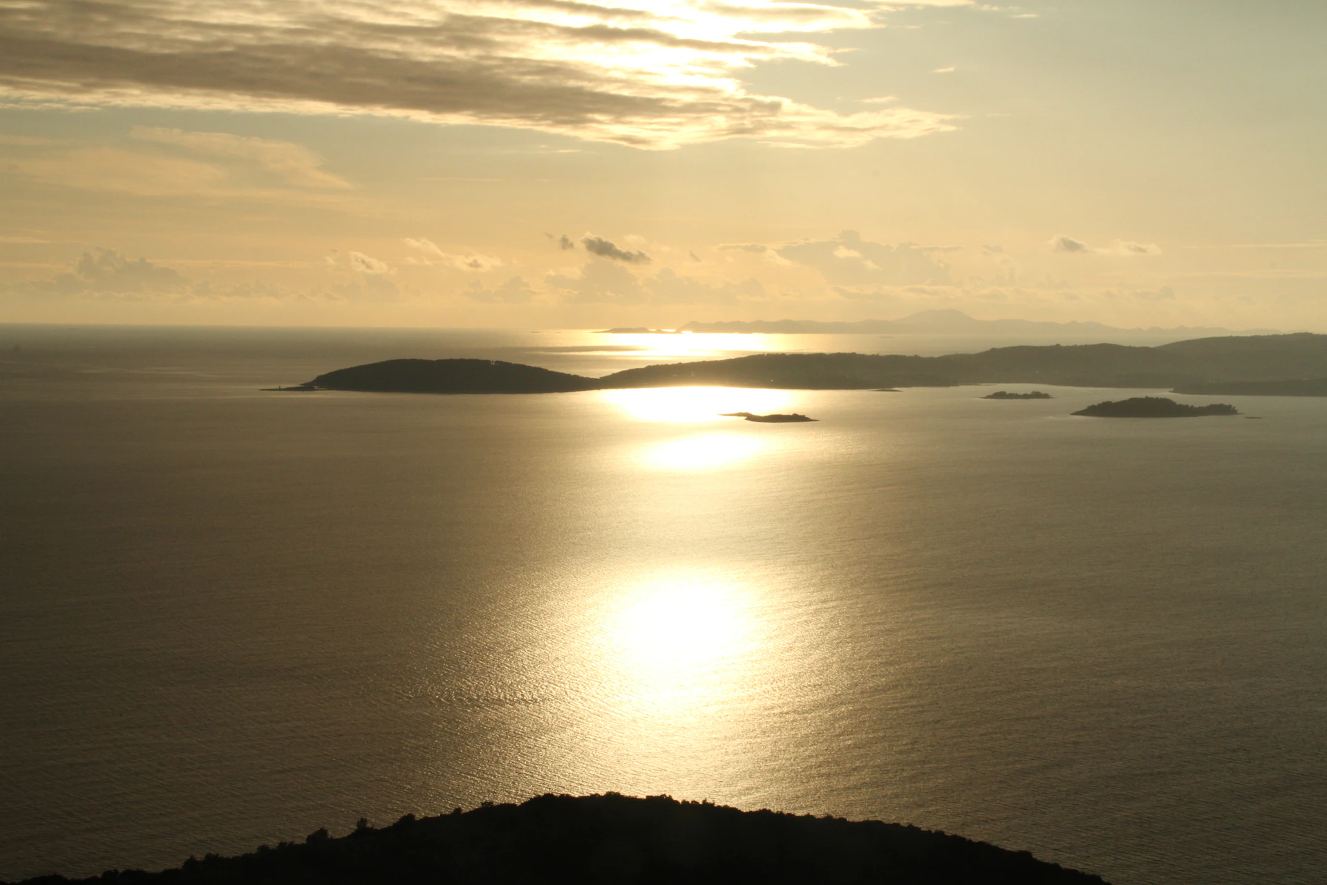woman wearing yellow long-sleeved dress under white clouds and blue sky during daytime
