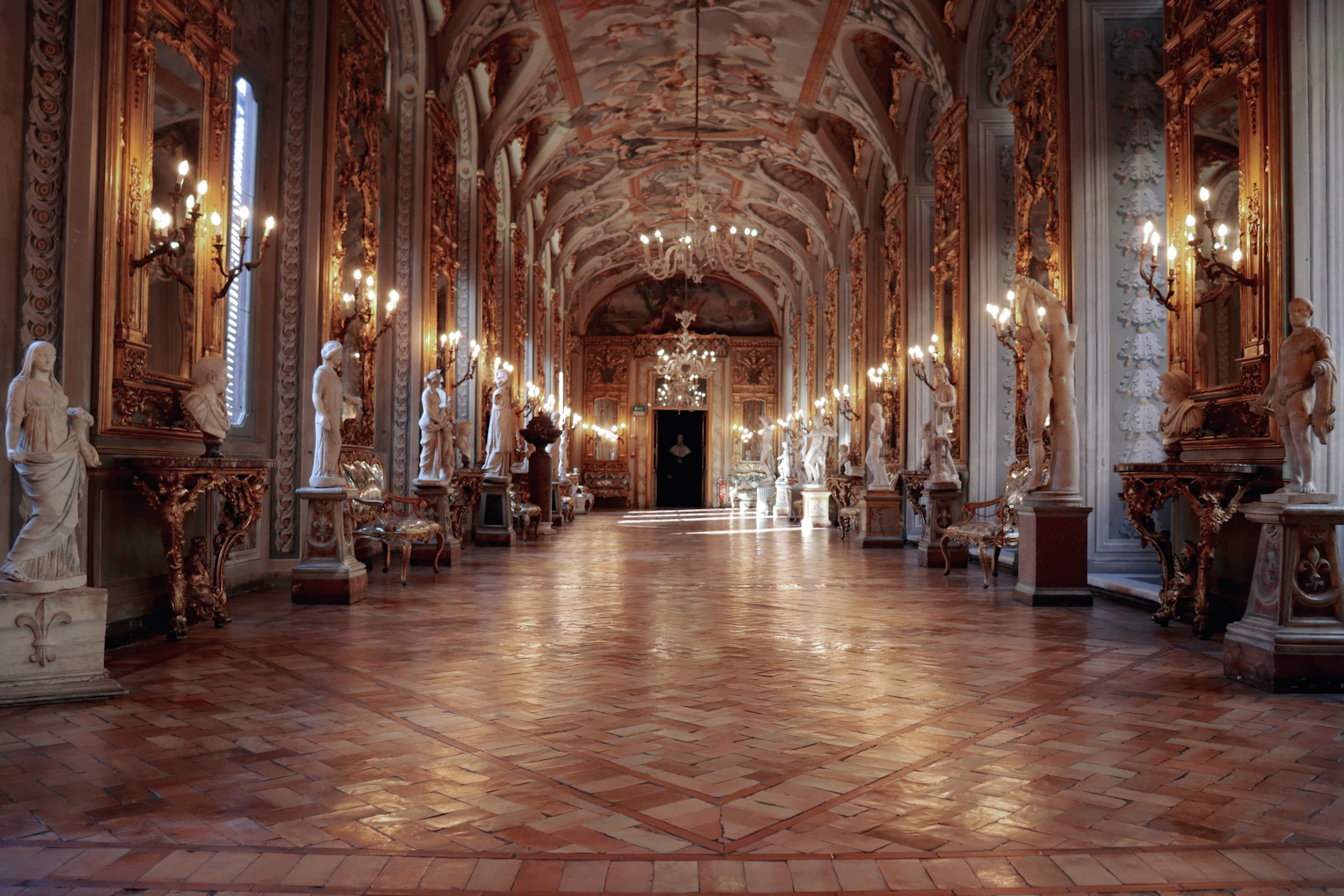 Historic Italian gallery interior with paintings and sculpture