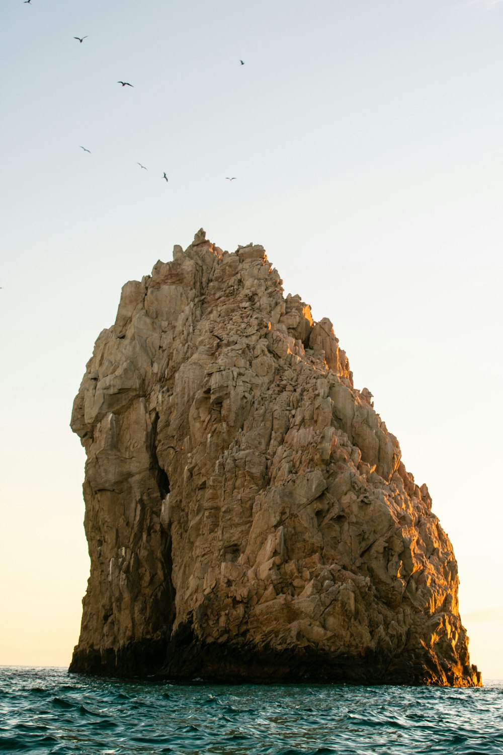 brown rock formation under white sky during daytime