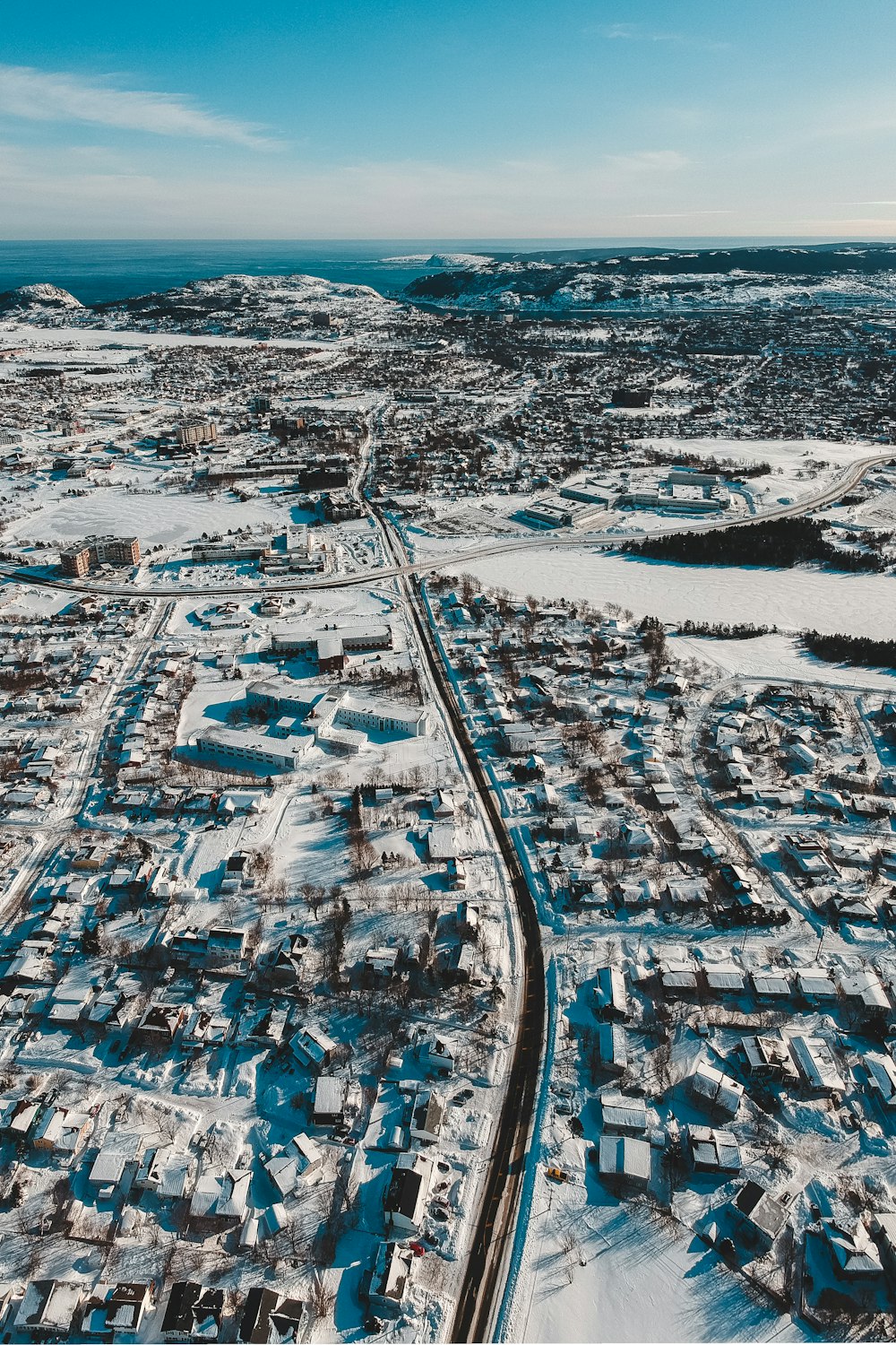 an aerial view of a snow covered town