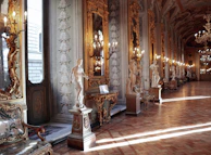 Inviting entrance hall with polished marble floors and subtle gold detailing.