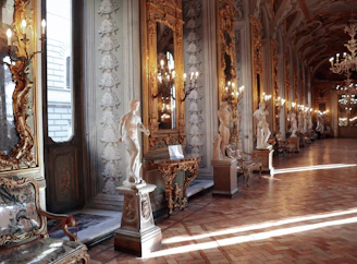 Inviting entrance hall with polished marble floors and subtle gold detailing.