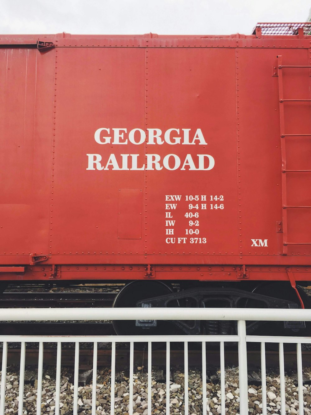 red and white metal container