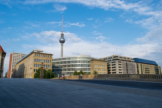 white concrete building near body of water during daytime in Lustgarten Germany