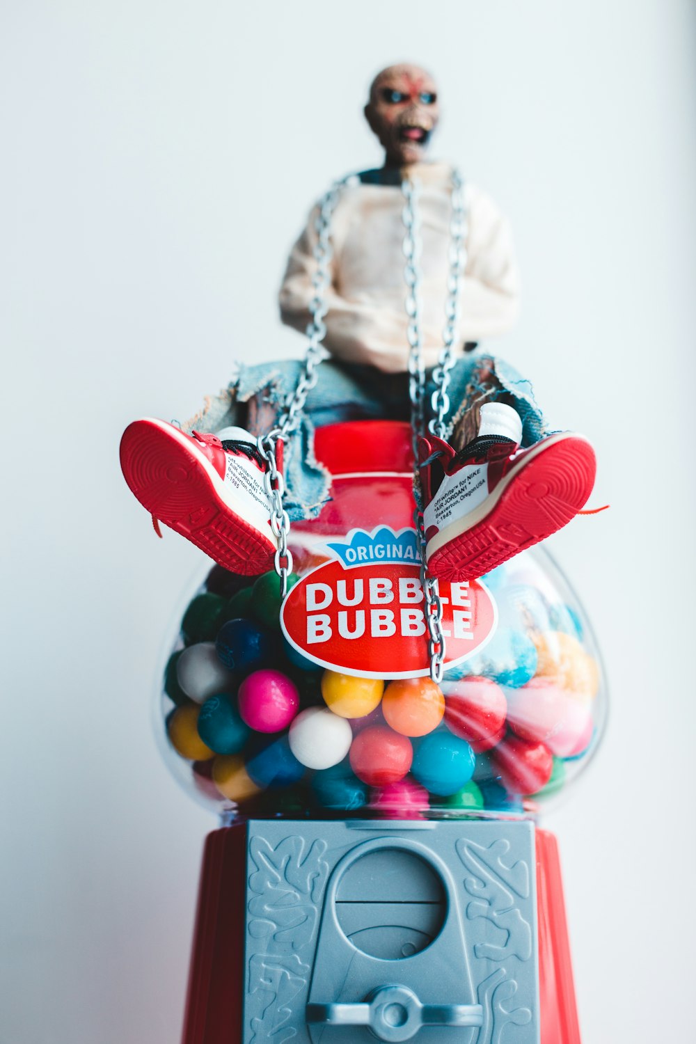 a gummy machine with a man sitting on top of it