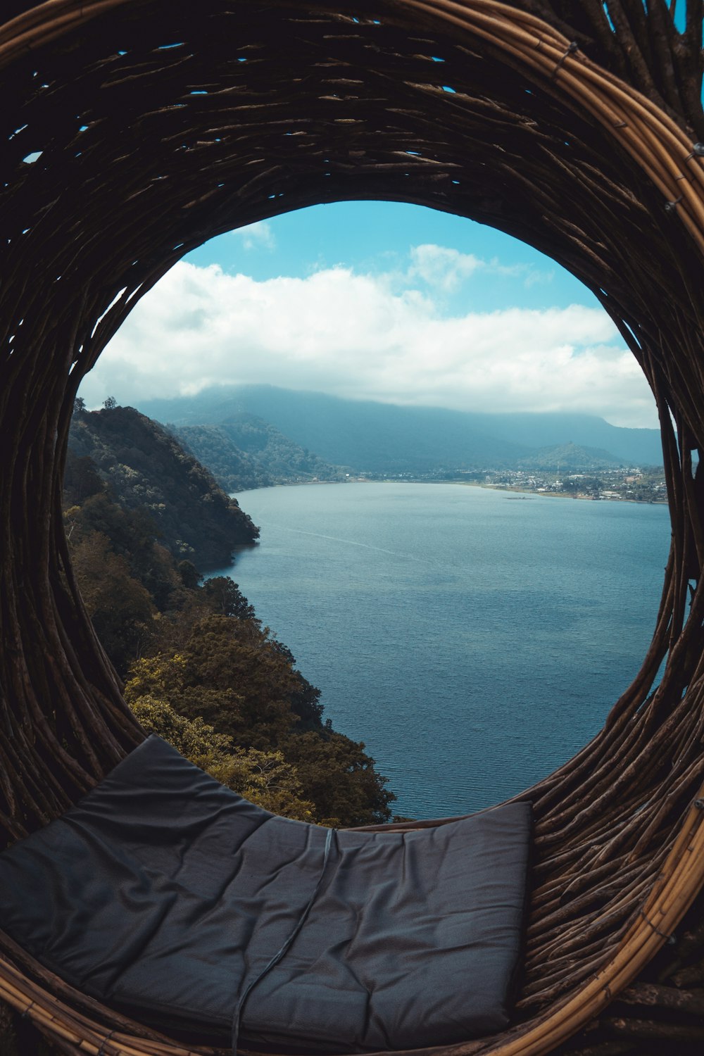 a view of a body of water from inside a wicker basket