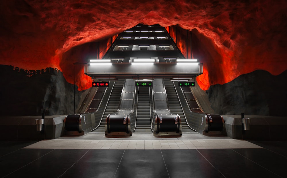 an underground subway station with escalators and stairs