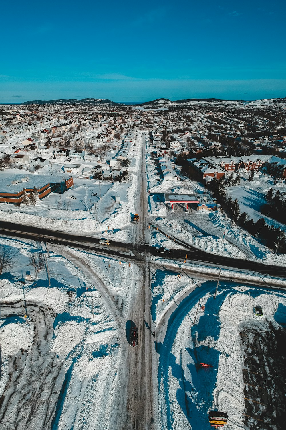 an aerial view of a highway in the winter