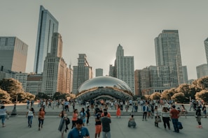 A group of people enjoying a public art event in a park.