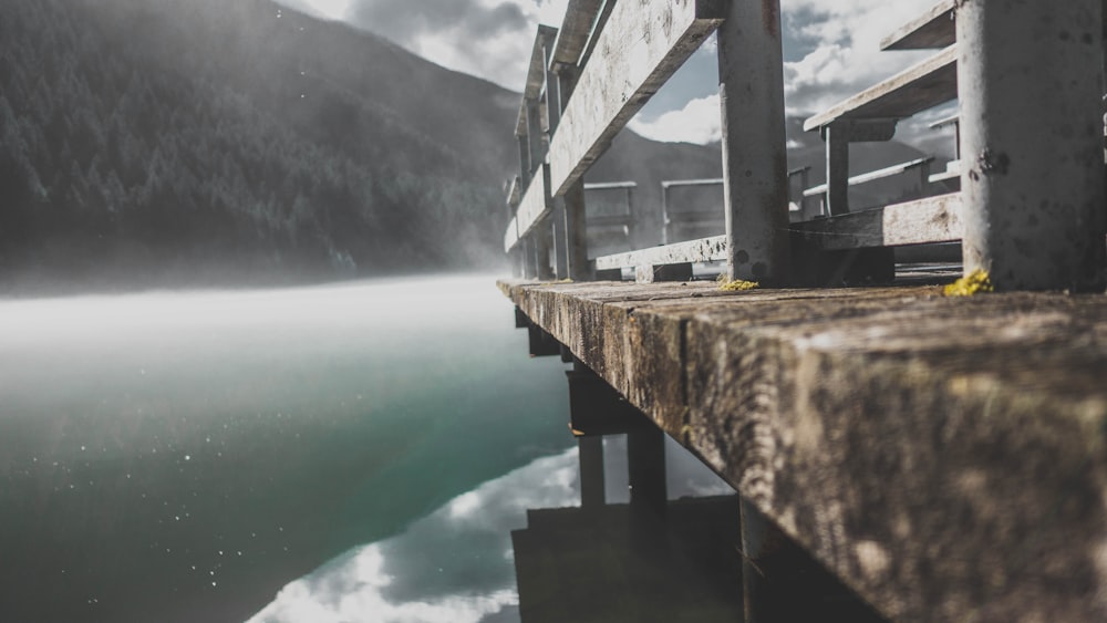 gray concrete bridge over the lake