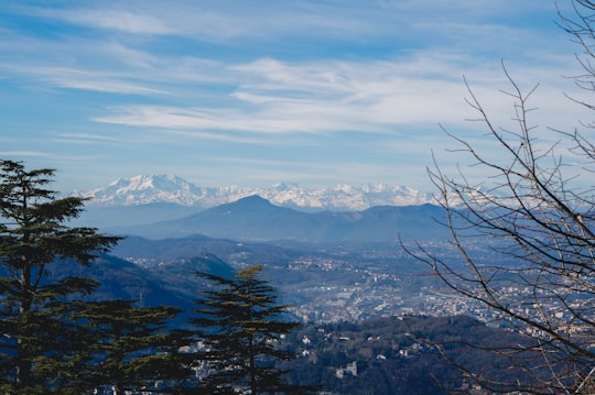 snow covered mountains under cloudy sky during daytime in Brunate Italy