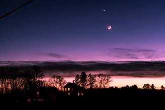 A serene twilight scene with a soft glowing light symbolizing the passage to the afterlife.