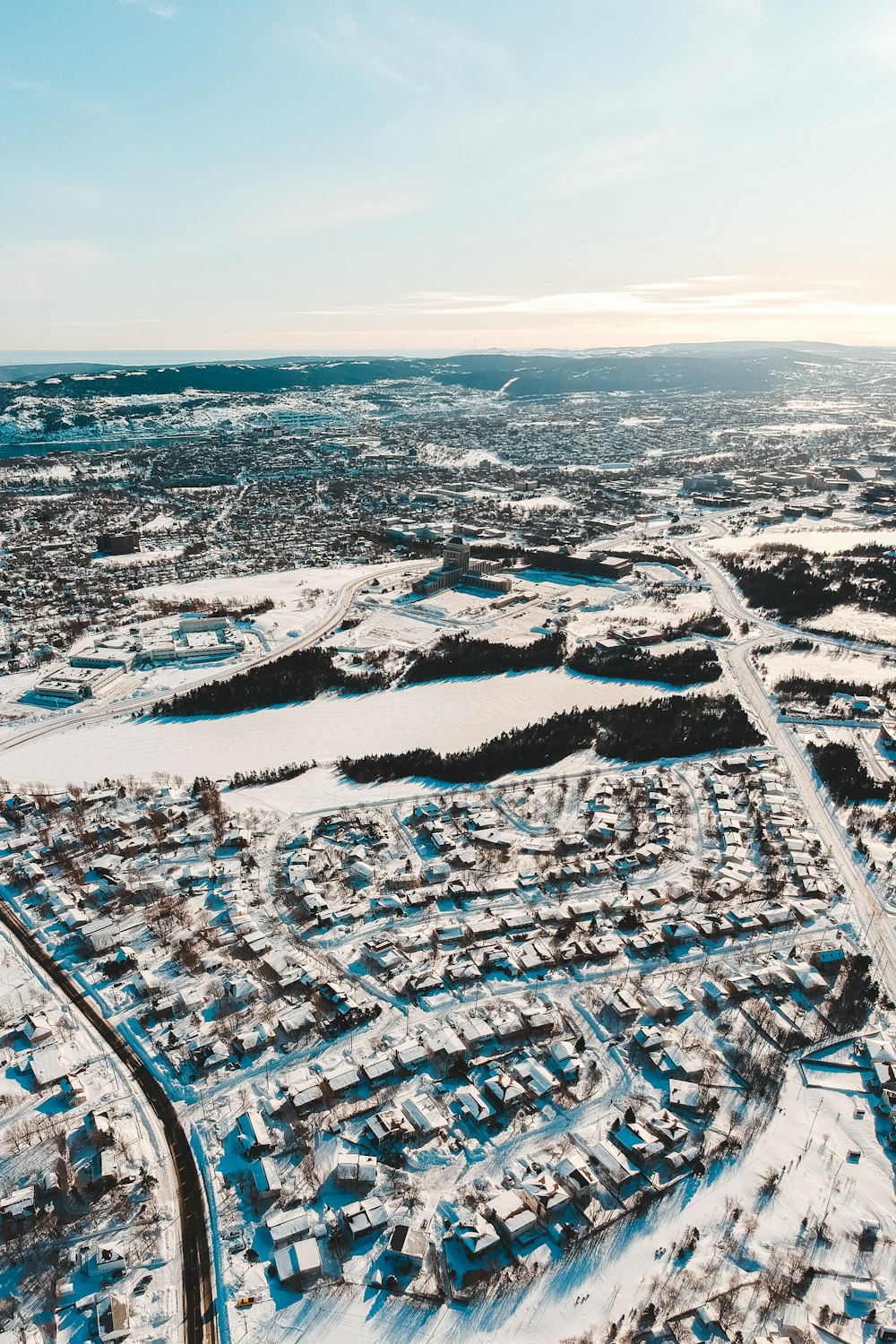 an aerial view of a city in winter