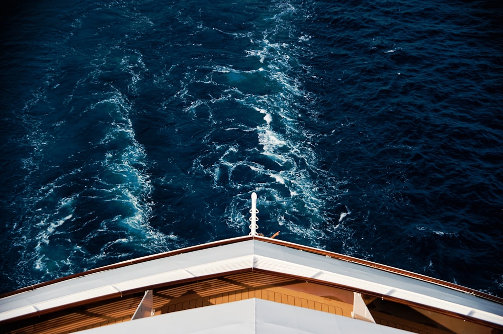 the view from the top of a ship looking down at the water