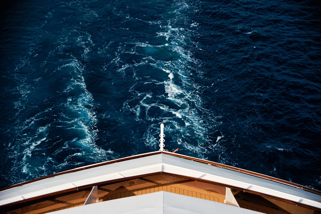the view from the top of a ship looking down at the water,