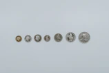 a row of five different types of coins