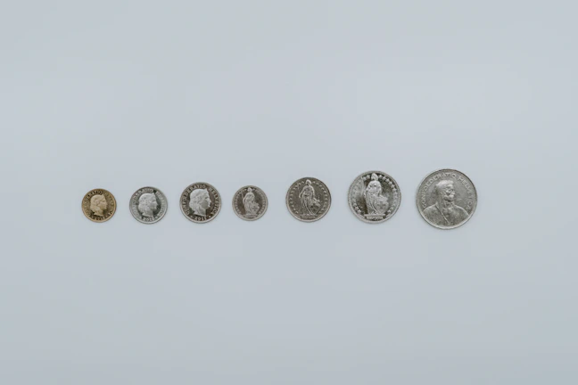 a row of five different types of coins