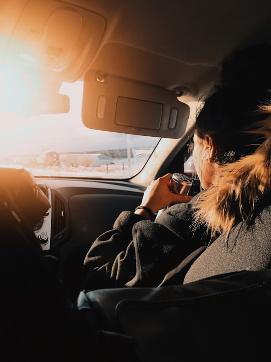 woman in black jacket driving car during sunset in Mont-Joli Canada