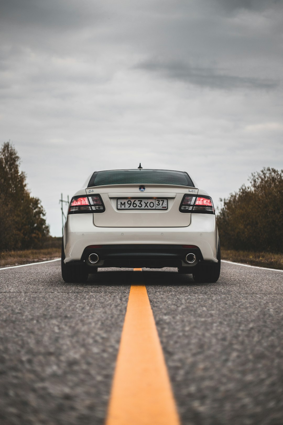 white bmw car on road during daytime