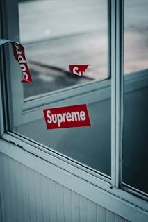 Close-up of a glossy, high-quality business decal on a shop window.