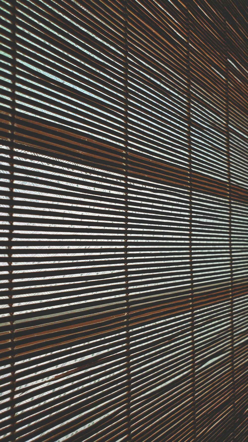 brown window blinds during daytime