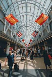 a group of people walking through a building