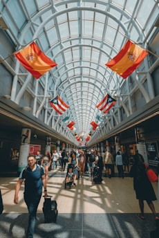 a group of people walking through a building