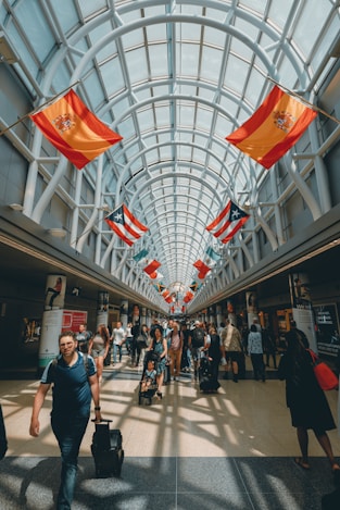 a group of people walking through a building