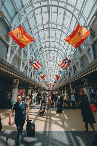 a group of people walking through a building