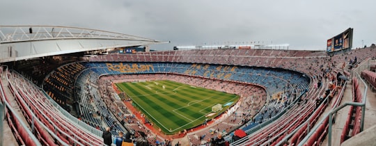 people watching football game during daytime in Camp Nou Spain