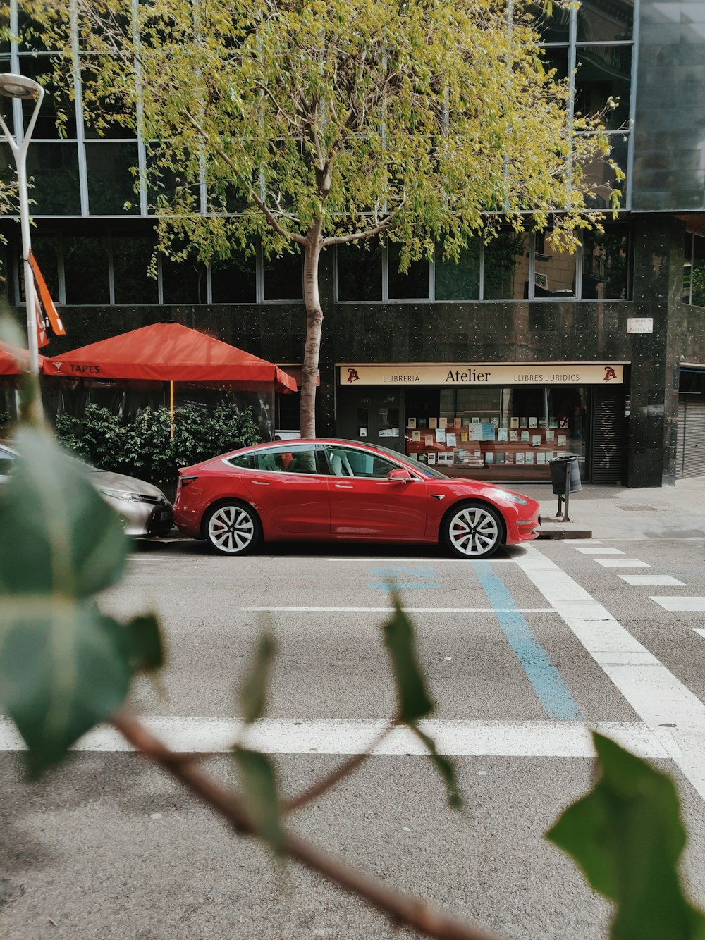 red sedan on road during daytime