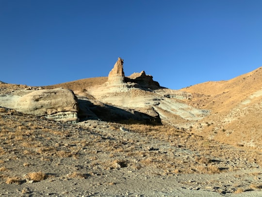 brown rock formation under blue sky during daytime in Maragheh Iran