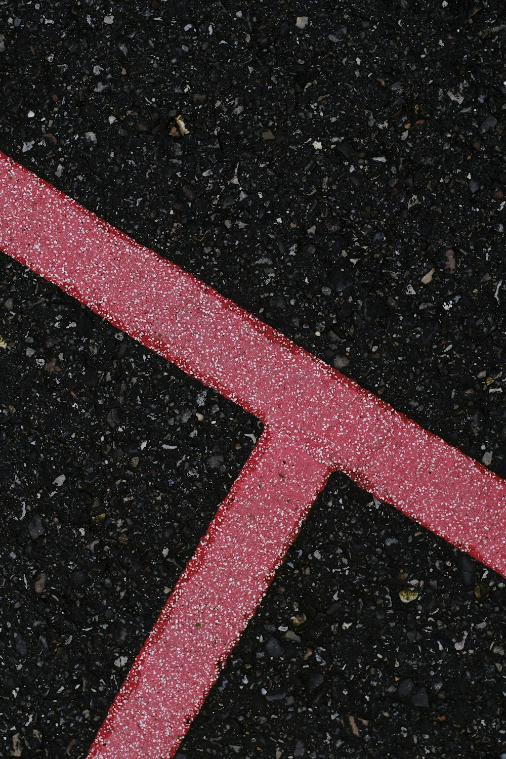 a close up of a street sign on the ground