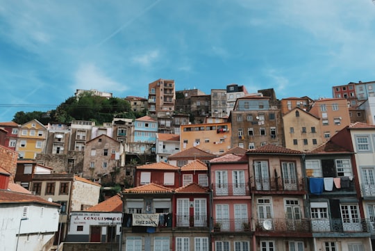 brown and white concrete houses under blue sky during daytime in Museum of Transport and Communication Portugal