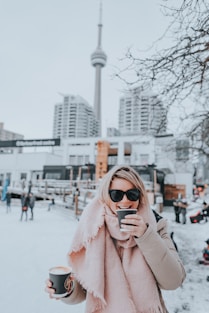 a woman is taking a picture of herself in the snow