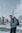 a man with a backpack standing in the snow