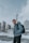 a man with a backpack standing in the snow