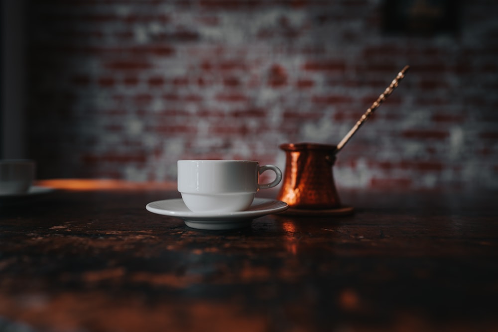 a coffee cup and saucer on a table