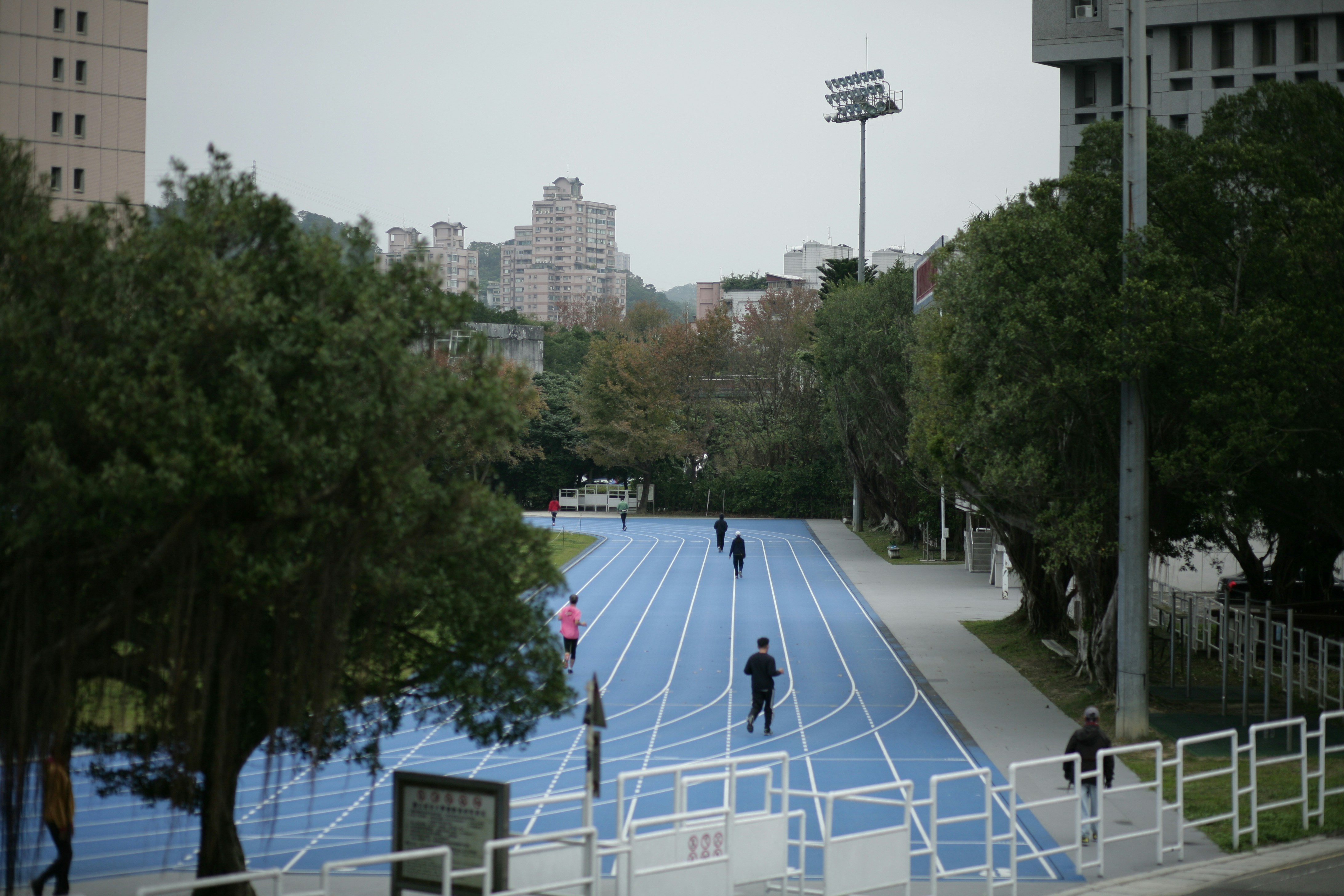 Athletes on blue track