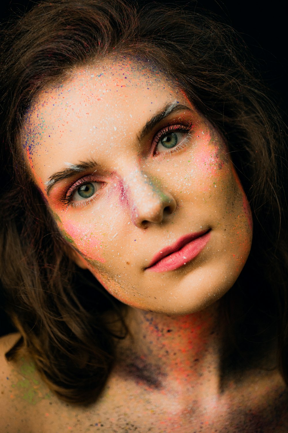 a woman with a lot of paint on her face